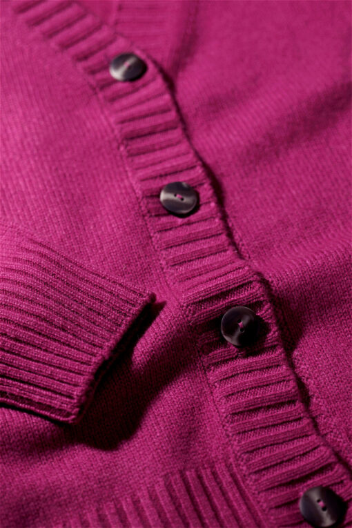 close-up on a cardigan in a amaranth color