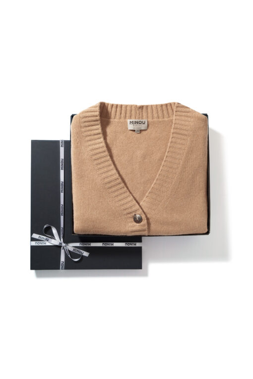 cardigan in camel color folded in a giftbox